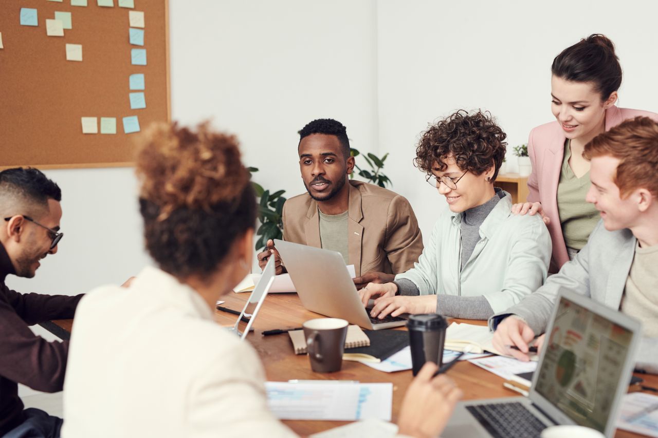 Professionals discussing a shared project around a table